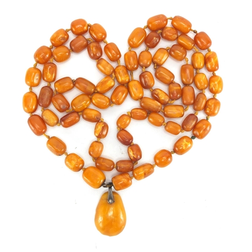 806 - Butterscotch amber coloured bead necklace, 110cm in length, approximate weight 62.0g