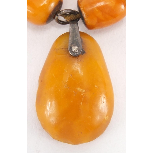 806 - Butterscotch amber coloured bead necklace, 110cm in length, approximate weight 62.0g