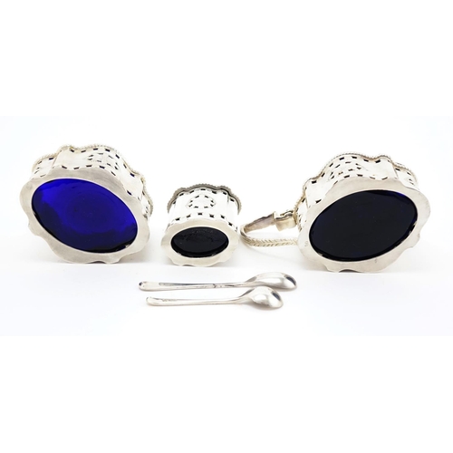 624 - Silver three piece cruet with pierced decoration an blue glass liners, by Francis Howard Ltd. Sheffi... 