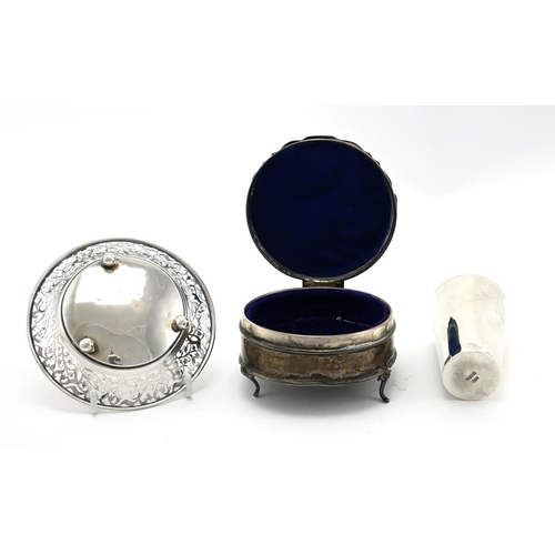 630 - Circular silver three footed jewel box, bon bon dish and beaker, various hallmarks, the largest 11cm... 