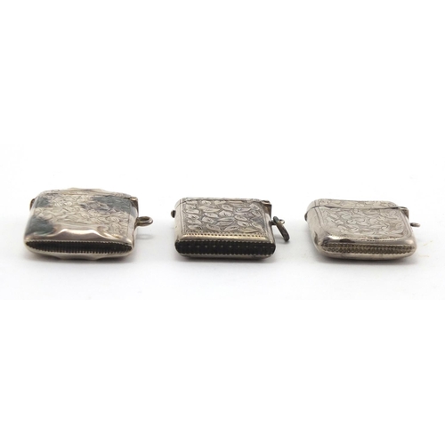 625 - Three rectangular silver vesta's with engraved floral decoration, Birmingham and Chester hallmarks, ... 