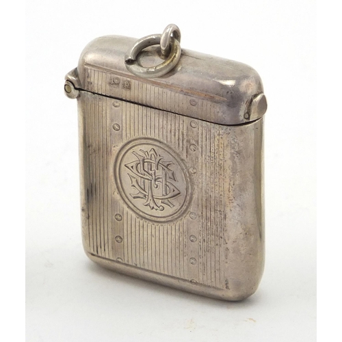 612 - Four rectangular silver vesta's with engine turned and chased decoration, Birmingham hallmarks, the ... 