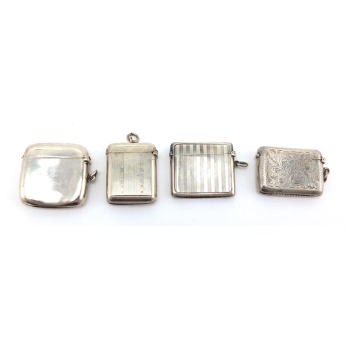 612 - Four rectangular silver vesta's with engine turned and chased decoration, Birmingham hallmarks, the ... 