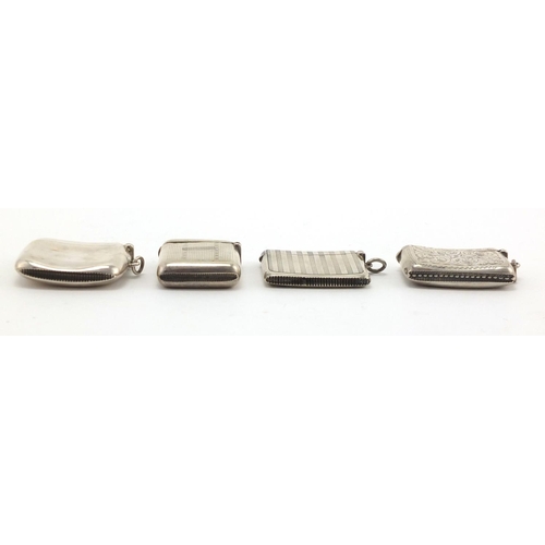 612 - Four rectangular silver vesta's with engine turned and chased decoration, Birmingham hallmarks, the ... 