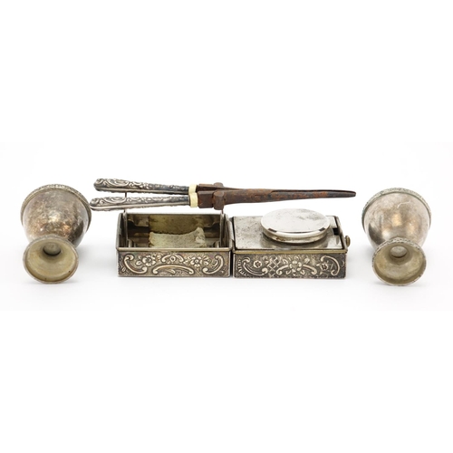 652 - Silver handled hair curlers with burners and pair of egg cups, the curlers 17cm in length, approxima... 