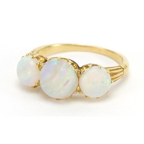 731 - Unmarked gold cabochon opal three stone ring, size O, approximate weight 3.9g