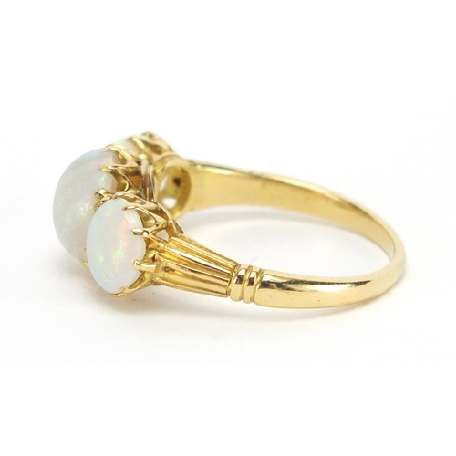 731 - Unmarked gold cabochon opal three stone ring, size O, approximate weight 3.9g