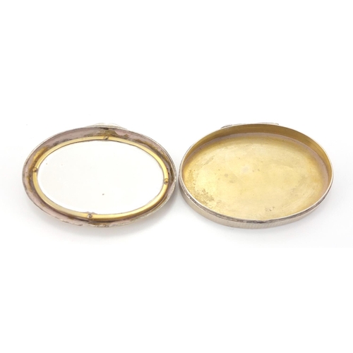 633 - Continental oval 800 grade silver box, the hinged lid inset with an ivory panel of a female with a d... 