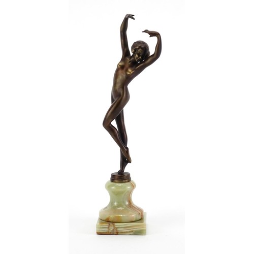 567 - Patinated bronze study of a nude Art Deco female raised on a green onyx base, 25cm high