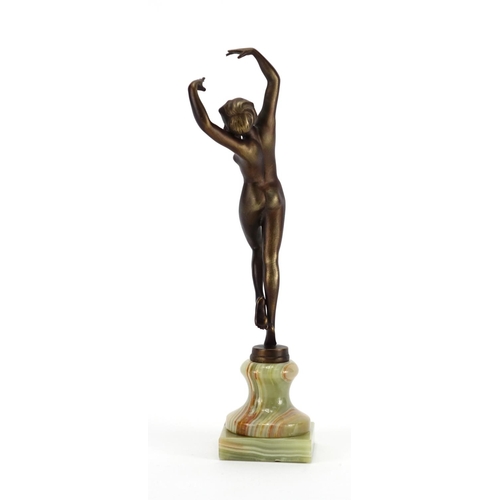 567 - Patinated bronze study of a nude Art Deco female raised on a green onyx base, 25cm high