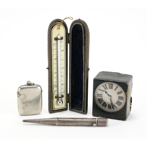 42 - Miscellaneous objects comprising a silver vesta, Parker's pointer pencil, leather cased travel clock... 