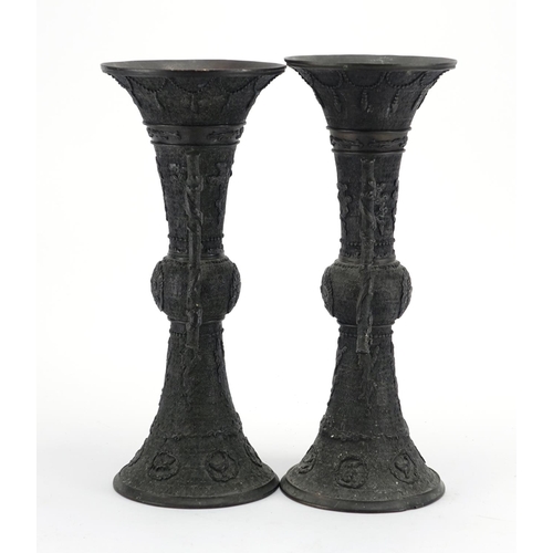 358 - Pair of Japanese bronze vases with tin handles, cast with mythical animals, each 36.5cm high