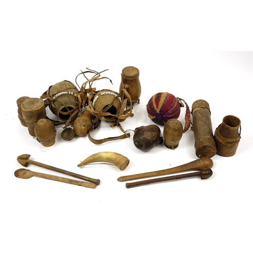 473 - Tribal woodenware including spoons, drums and water carriers with cowry shells, the largest 52cm in ... 