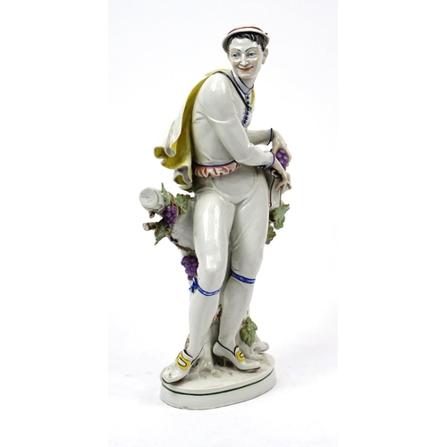 483 - Large 19th century continental hand painted porcelain figure of a grape picker, incised HM27 and fac... 