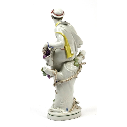 483 - Large 19th century continental hand painted porcelain figure of a grape picker, incised HM27 and fac... 
