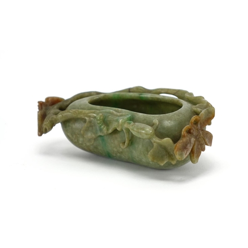 393 - Chinese green and russet jade naturalistic brush washer, carved with a bat and butterfly, 14cm wide