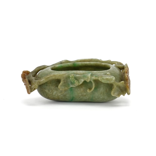 393 - Chinese green and russet jade naturalistic brush washer, carved with a bat and butterfly, 14cm wide