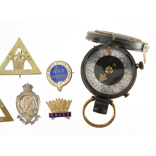 218 - World War I Verner's pattern compass together with a group of badges including two On War Service ex... 