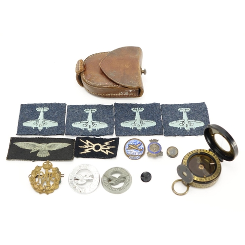 219 - Military interest compass with tan leather case together with a group of cloth patches and badges in... 