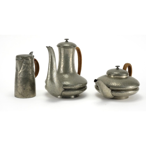 583 - Tudric pewter coffee pot, teapot and jug, each with impressed marks and numbered to the bases, the l... 