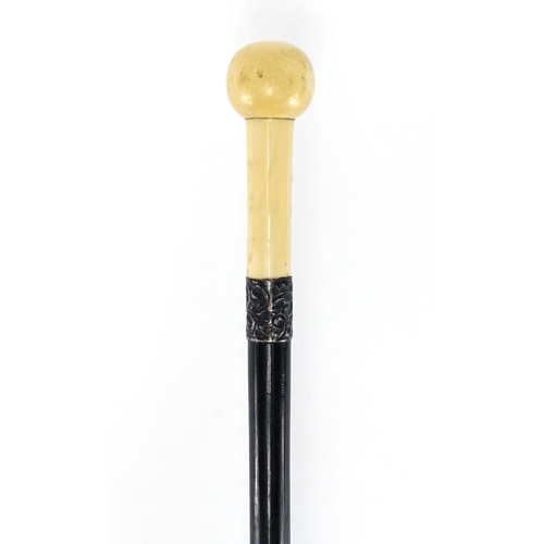 76 - Ebonised walking stick with turned marine ivory pommel and silver collar, indistinct London hallmark... 