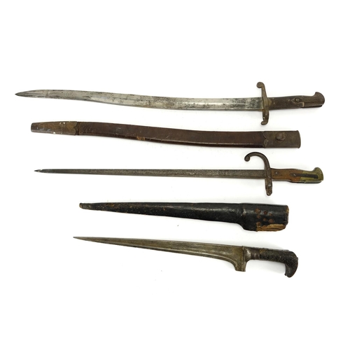 256 - Two Military interest long bayonets and an Afghan dagger with scabbard, the largest 74cm in length