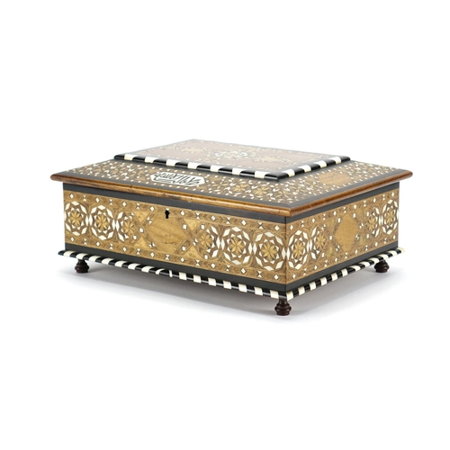 479 - Islamic Moorish style inlaid wooden casket with geometric inlay and script, the hinged lid opening t... 