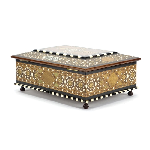 479 - Islamic Moorish style inlaid wooden casket with geometric inlay and script, the hinged lid opening t... 