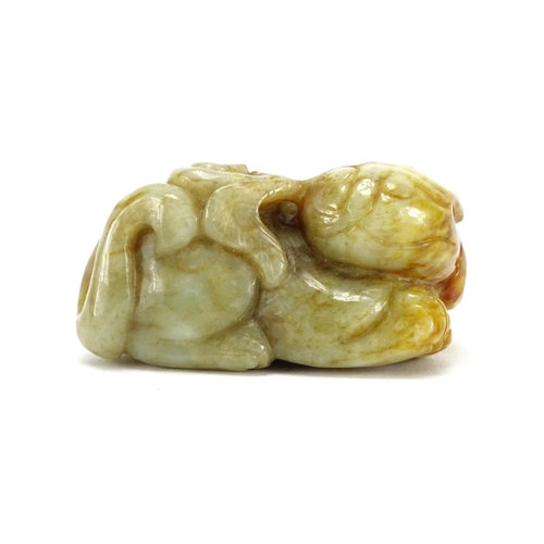 391 - Chinese green and russet jade carving of a mythical character, 6.5cm wide