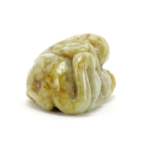 391 - Chinese green and russet jade carving of a mythical character, 6.5cm wide