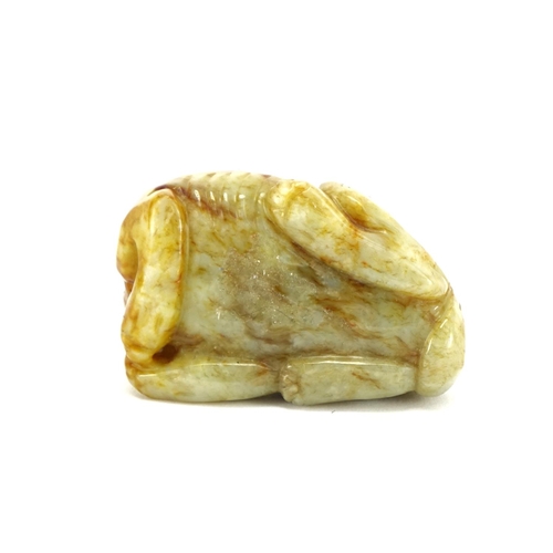 391 - Chinese green and russet jade carving of a mythical character, 6.5cm wide