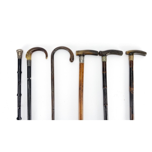 82A - Group of six walking sticks, four with horn handles and three with silver mounts, the largest 97cm i... 