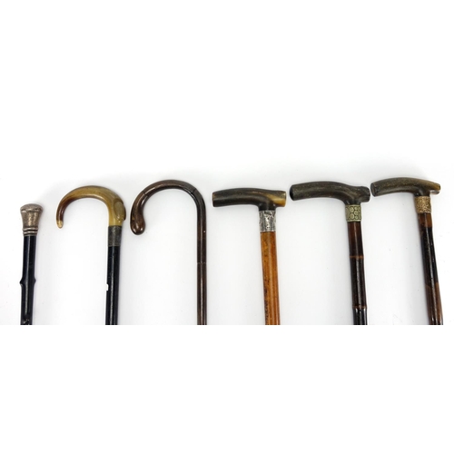 82A - Group of six walking sticks, four with horn handles and three with silver mounts, the largest 97cm i... 