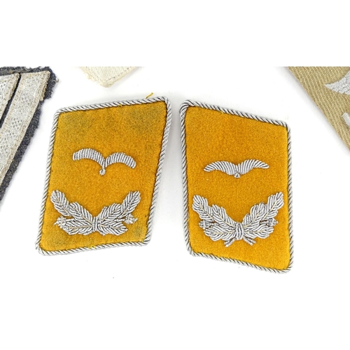 231 - Group of German Military interest cloth patches and epaulettes