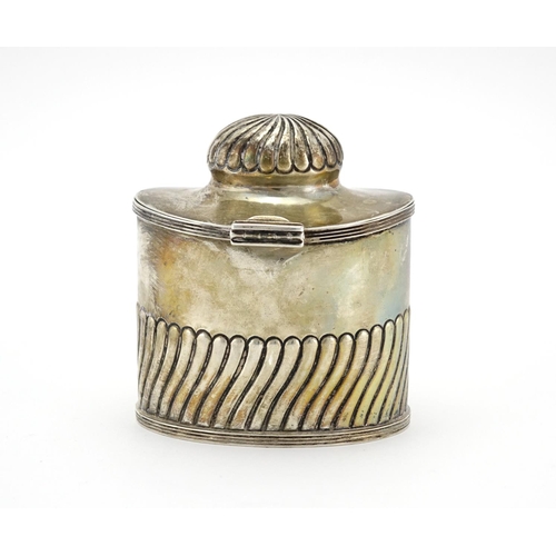 618 - Silver demi fluted tea caddy with fitted spoon to the interior and hinged lid, indistinct makers mar... 