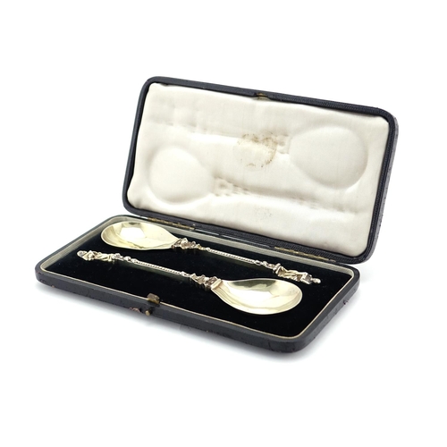 640 - Pair of Victorian silver gilt apostle spoons by Louise Landsberg, London import marks 1894, housed i... 