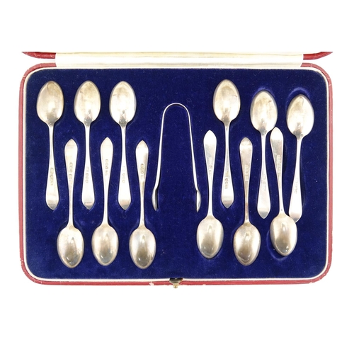 663 - Set of twelve silver teaspoons and sugar tongs, by Hamilton & Inches, Edinburgh 1934, housed in a ve... 