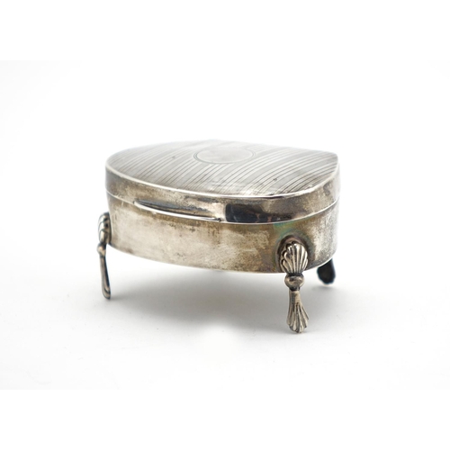 641 - Silver four footed jewel box, the hinged lid with engine turned decoration, I J C Birmingham 1919, 7... 