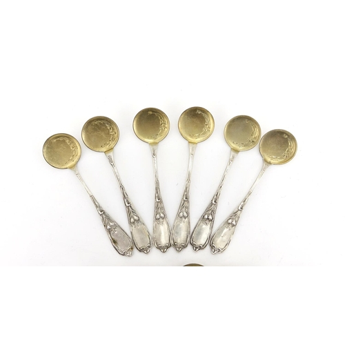 657 - Set of twelve Russian silver ice cream spoons, the stems with stylised flowers, each with impressed ... 