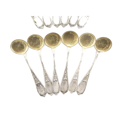 657 - Set of twelve Russian silver ice cream spoons, the stems with stylised flowers, each with impressed ... 