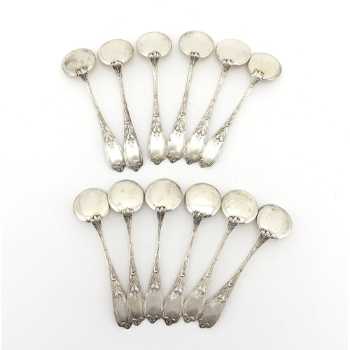 657 - Set of twelve Russian silver ice cream spoons, the stems with stylised flowers, each with impressed ... 