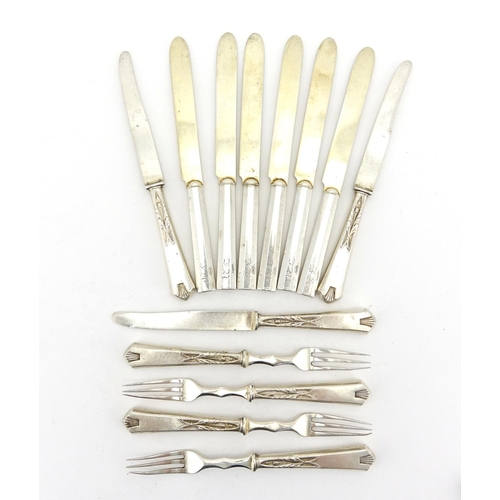 656 - Thirteen Russian silver knives and forks some with stylised flower handles, each with impressed 84 m... 