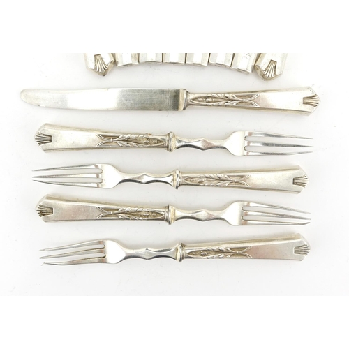 656 - Thirteen Russian silver knives and forks some with stylised flower handles, each with impressed 84 m... 