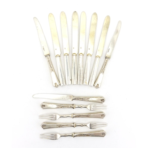 656 - Thirteen Russian silver knives and forks some with stylised flower handles, each with impressed 84 m... 