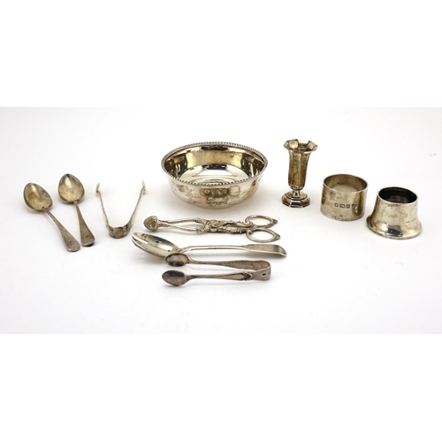 654 - Silver objects including circular bowl, Victorian sugar nips and Georgian teaspoons, various hallmar... 