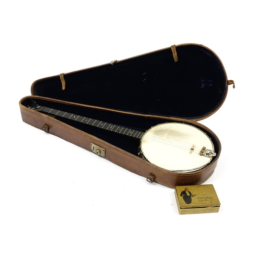 25 - A Weaver four string Banjo, housed in an A Weaver model leather case, 92cm in length