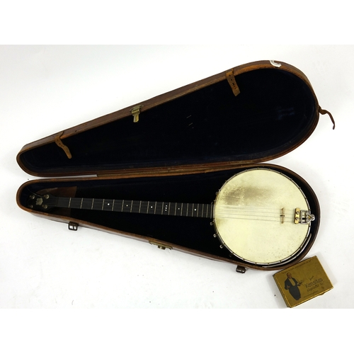 25 - A Weaver four string Banjo, housed in an A Weaver model leather case, 92cm in length