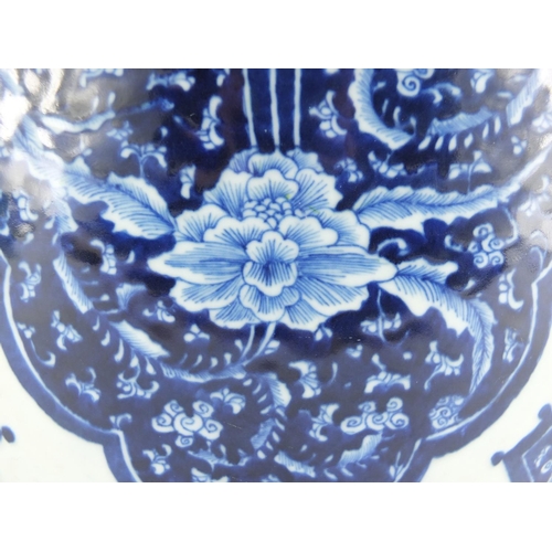 313 - Large Chinese blue and white porcelain baluster jar and cover, hand painted with flowers and foliage... 