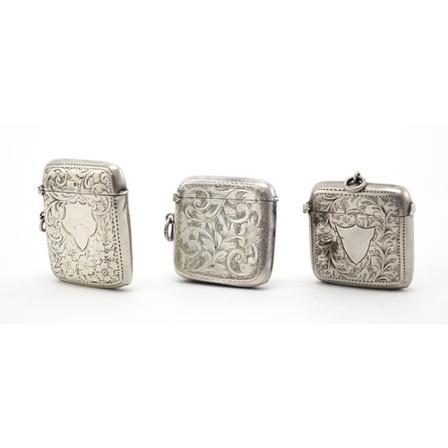644 - Three rectangular silver vesta's with engraved floral decoration, Birmingham hallmarks, the largest ... 
