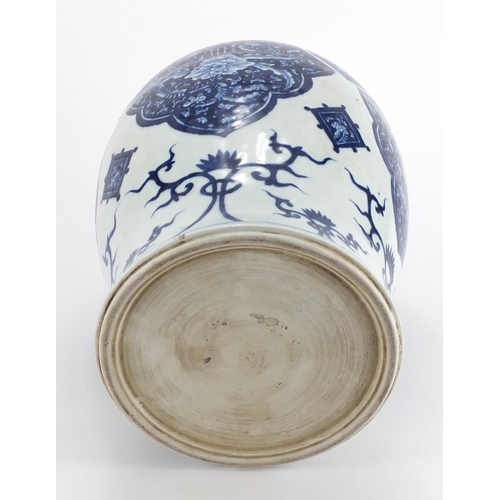 313 - Large Chinese blue and white porcelain baluster jar and cover, hand painted with flowers and foliage... 